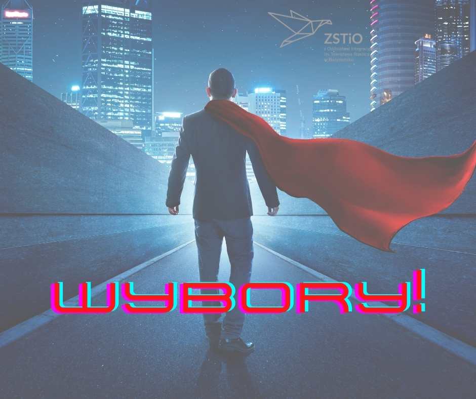 w tle wieżowce, noc, na pierwszym planie mężczyzna w pelerynie, napis wybory